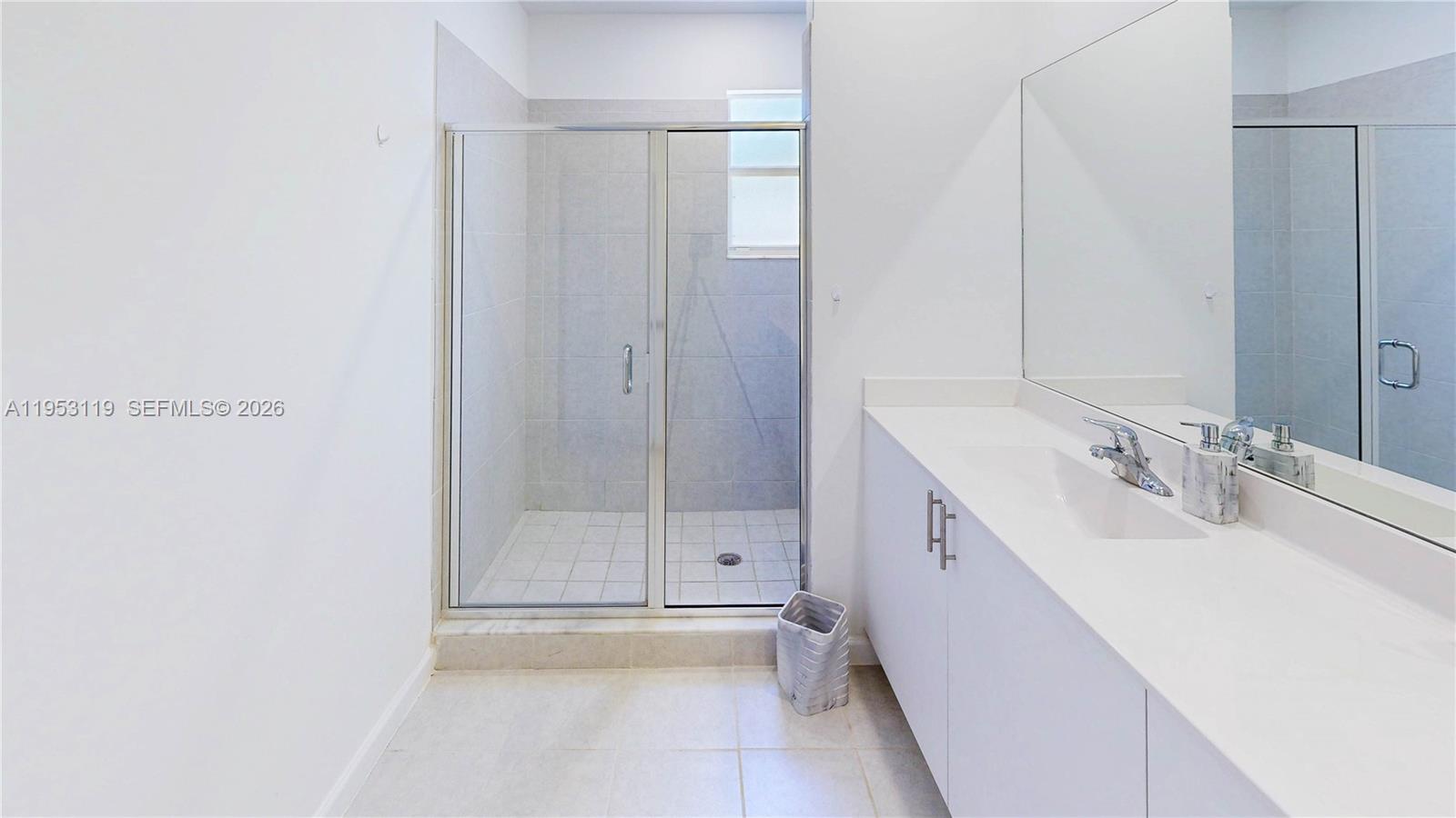 16233 Southwest 290th Terrace Homestead, FL 33033 - Photo 22 of 43 a bathroom with a double vanity sink and mirror