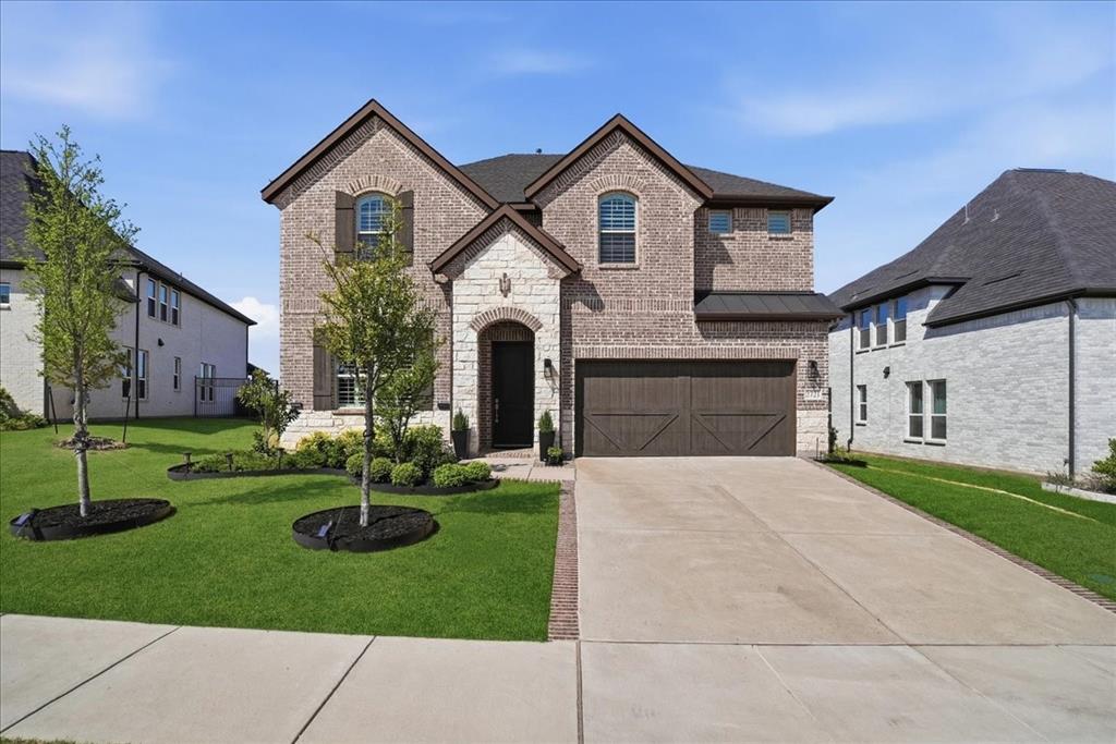 2721 Rotherham Street Prosper, TX 75078 - Photo 3 of 37 a front view of house with yard and green space