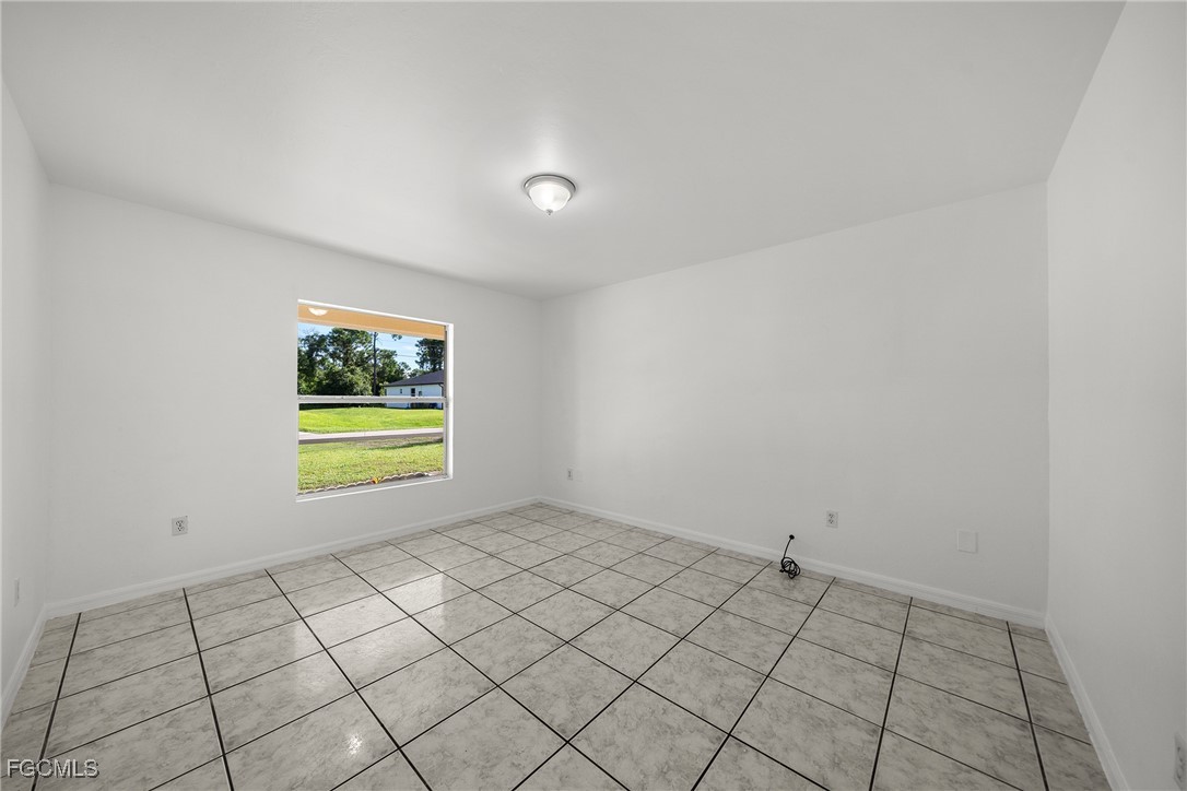 4733-4735 30th Street Southwest Lehigh Acres, FL 33973 - Photo 19 of 43 a view of an empty room and window