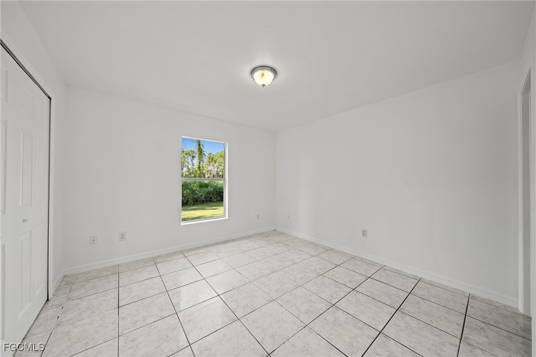 4733-4735 30th Street Southwest Lehigh Acres, FL 33973 - Photo 27 of 43 a view of an empty room and window