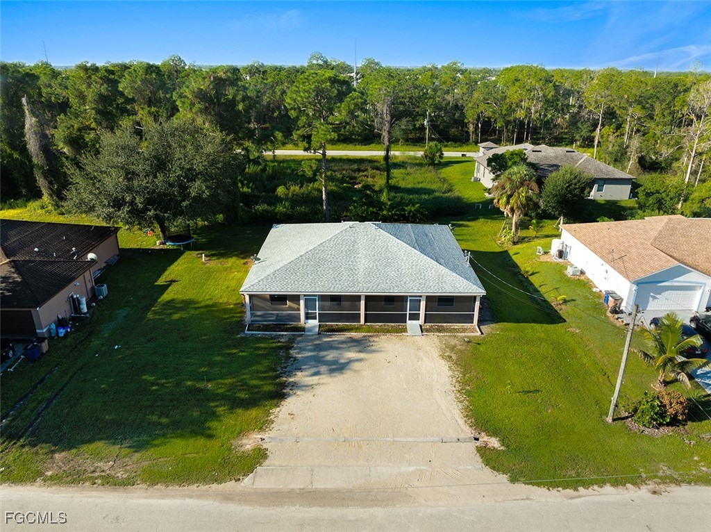 4733-4735 30th Street Southwest Lehigh Acres, FL 33973 - Photo 36 of 43 an aerial view of a house with swimming pool garden and patio