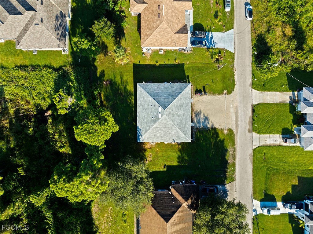4733-4735 30th Street Southwest Lehigh Acres, FL 33973 - Photo 39 of 43 an aerial view of a house with a yard swimming pool outdoor seating and yard