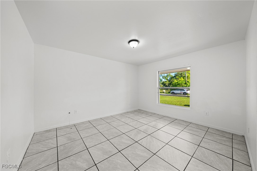 4733-4735 30th Street Southwest Lehigh Acres, FL 33973 - Photo 4 of 43 a view of an empty room and window