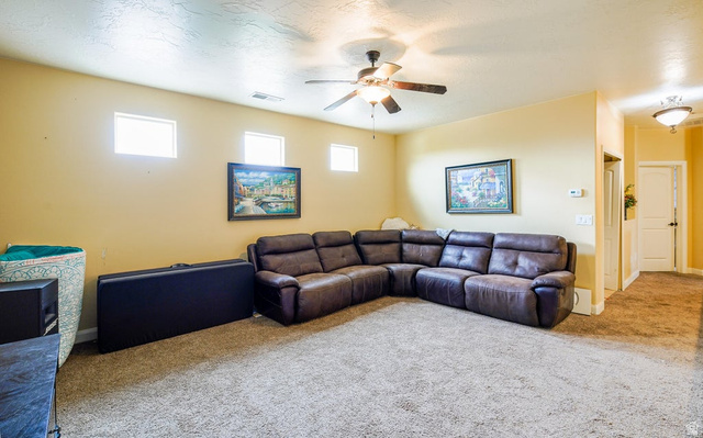 3683 South 2640 West St. George, UT 84790 - Photo 34 of 41 Spacious living area featuring neutral-toned carpeting and wall paint