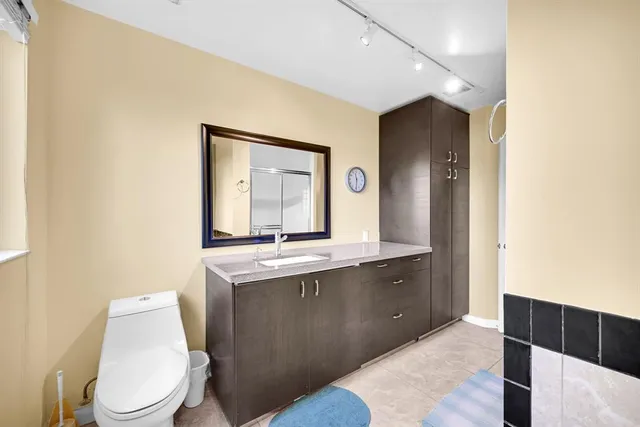 a view of a patio with a table chairs and a yard