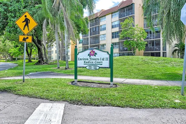 a view of a room with furniture and a window
