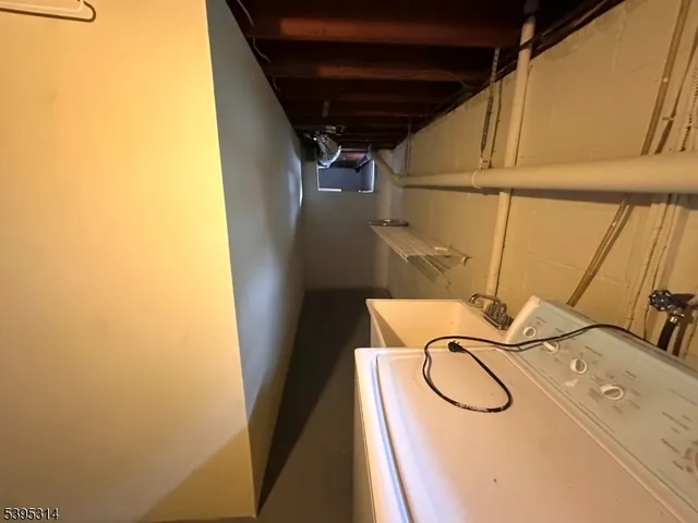 a view of a room with wooden floor and windows