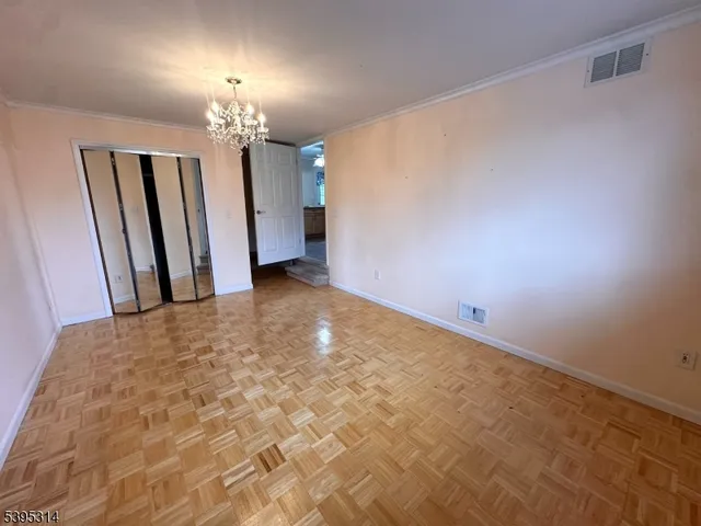 a view of a hallway with a chandelier