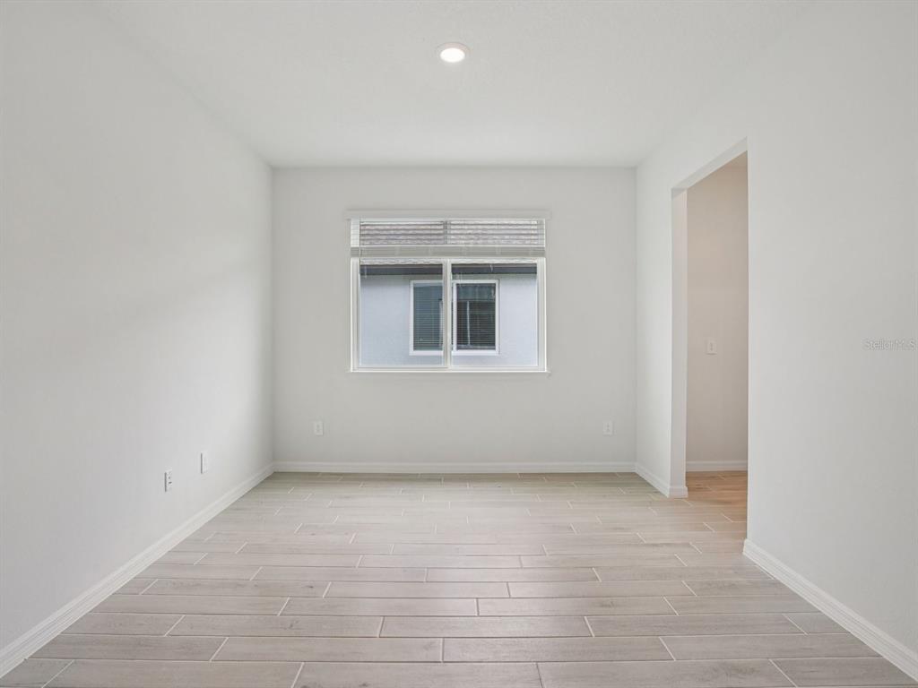 10821 Heirloom Farms Run Parrish, FL 34221 - Photo 4 of 13 an empty room with a window