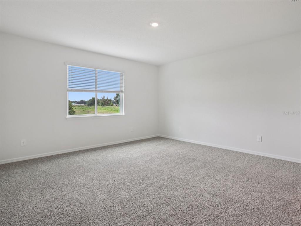 10821 Heirloom Farms Run Parrish, FL 34221 - Photo 6 of 13 an empty room with a window