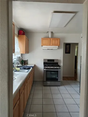 a kitchen with stainless steel appliances granite countertop a stove and a refrigerator
