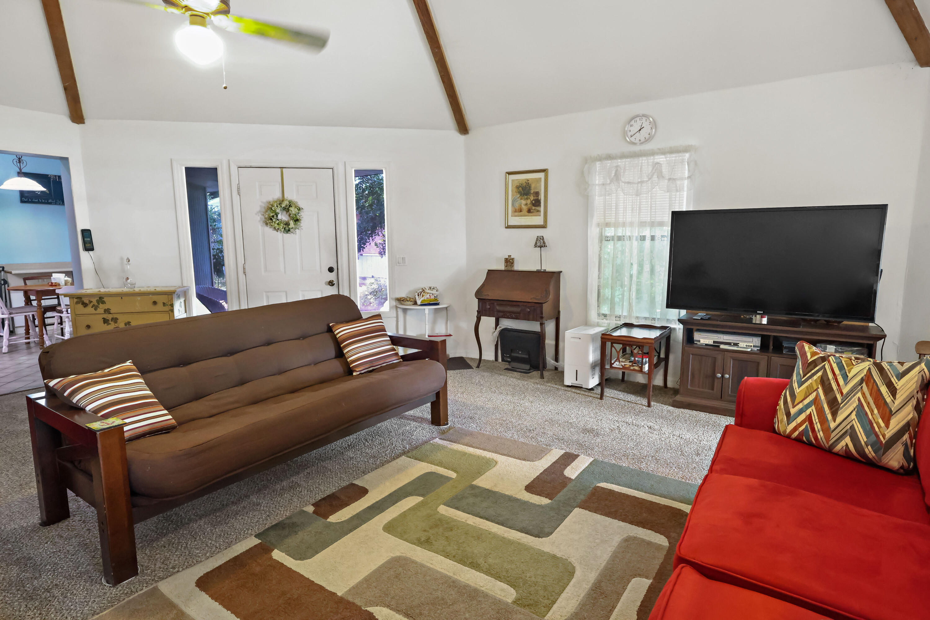 1466 24th Avenue Southwest Vero Beach, FL 32962 - Photo 1 of 29 a living room with furniture and a flat screen tv