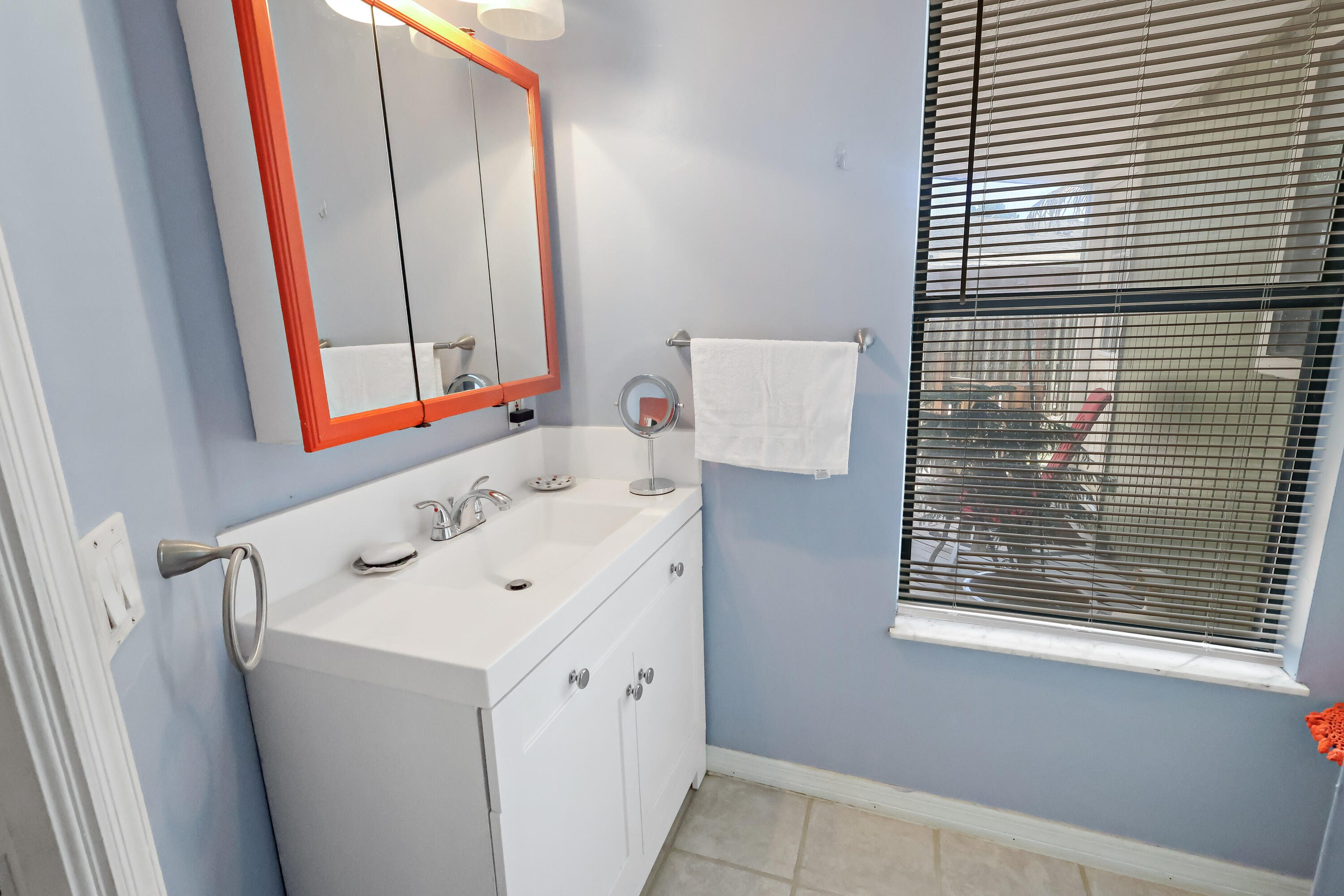 1466 24th Avenue Southwest Vero Beach, FL 32962 - Photo 11 of 29 a view of a bathroom with a sink and a window