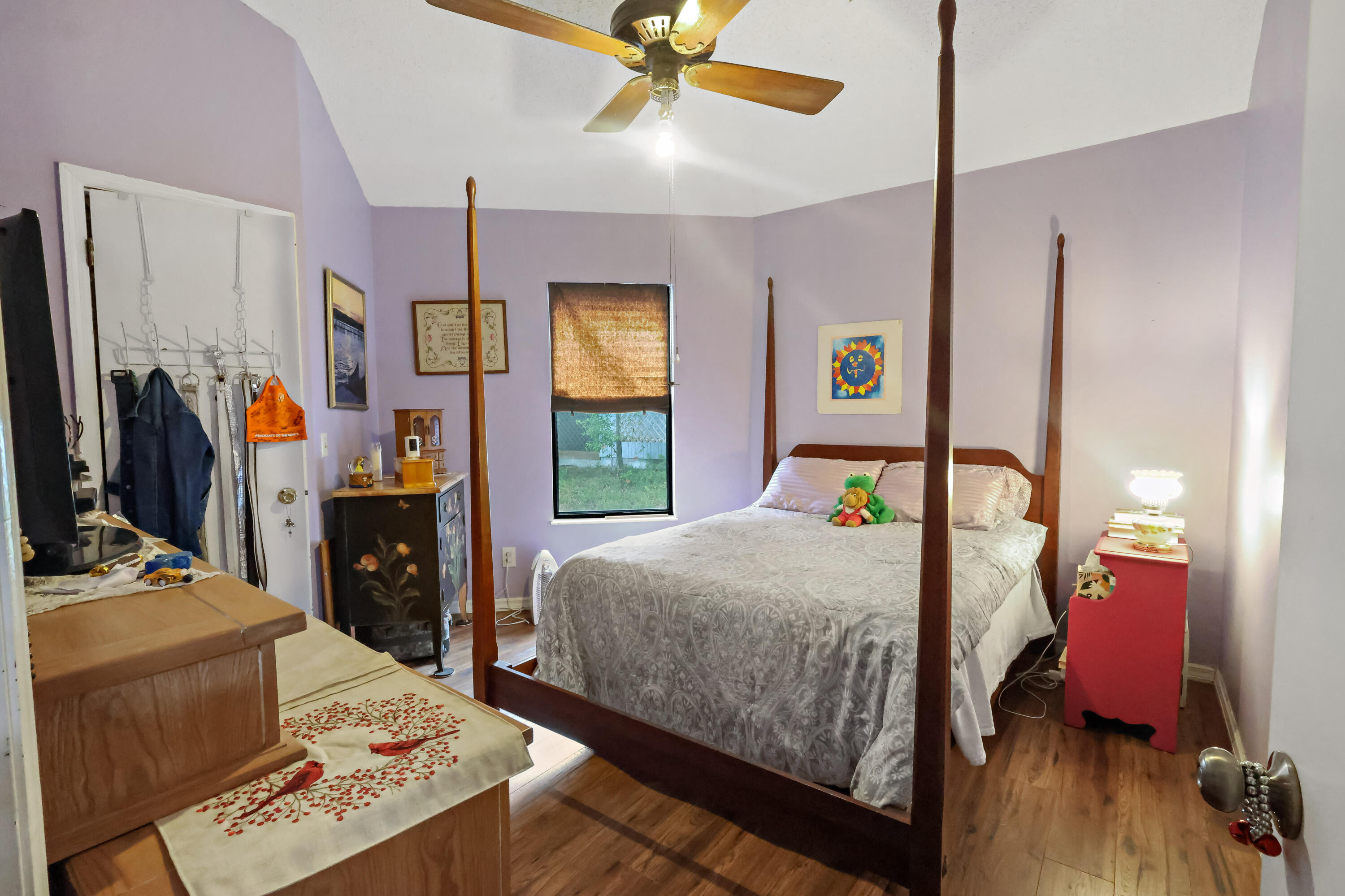 1466 24th Avenue Southwest Vero Beach, FL 32962 - Photo 13 of 29 a bedroom with a bed and a chandelier