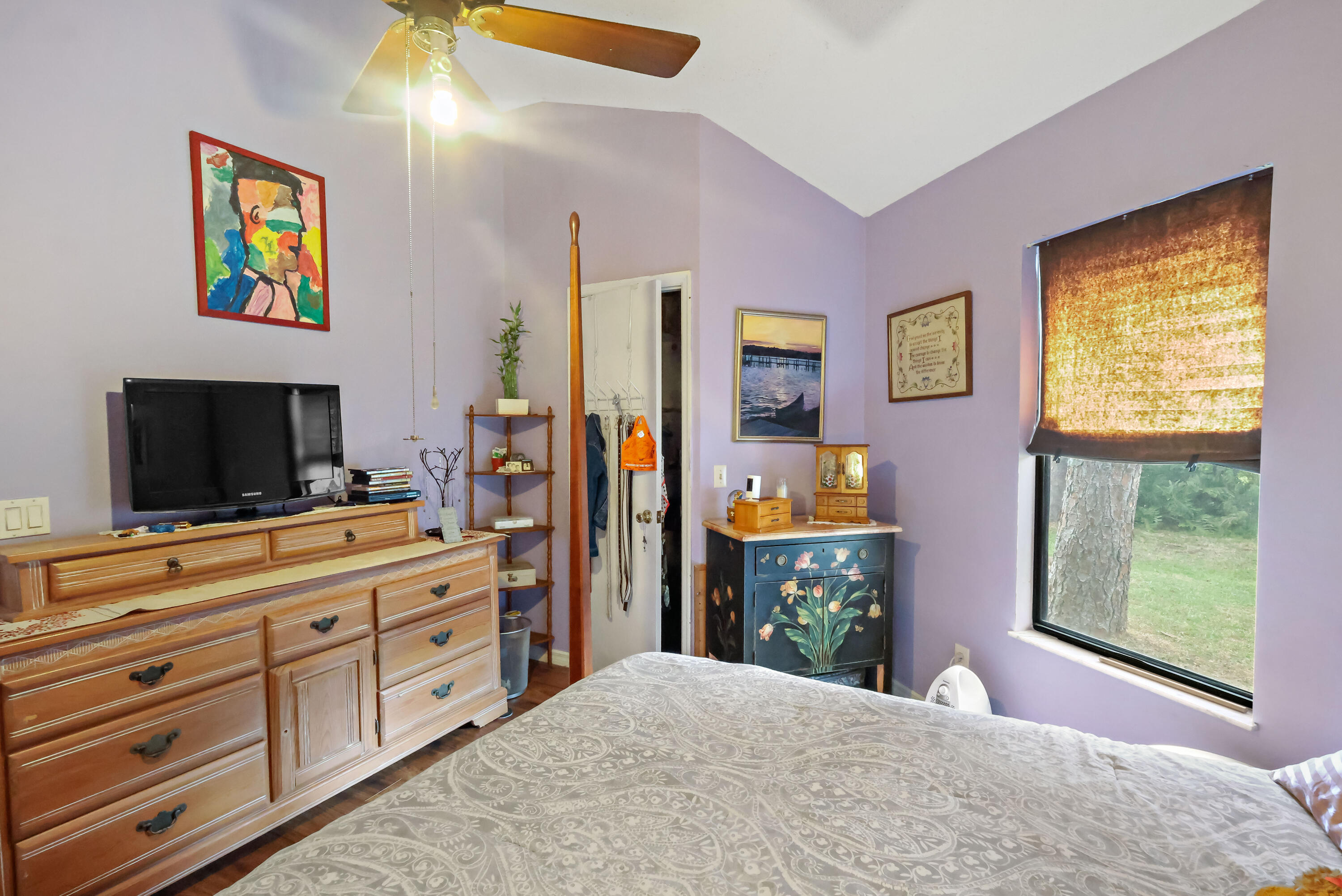 1466 24th Avenue Southwest Vero Beach, FL 32962 - Photo 14 of 29 a bedroom with a bed and a flat screen tv