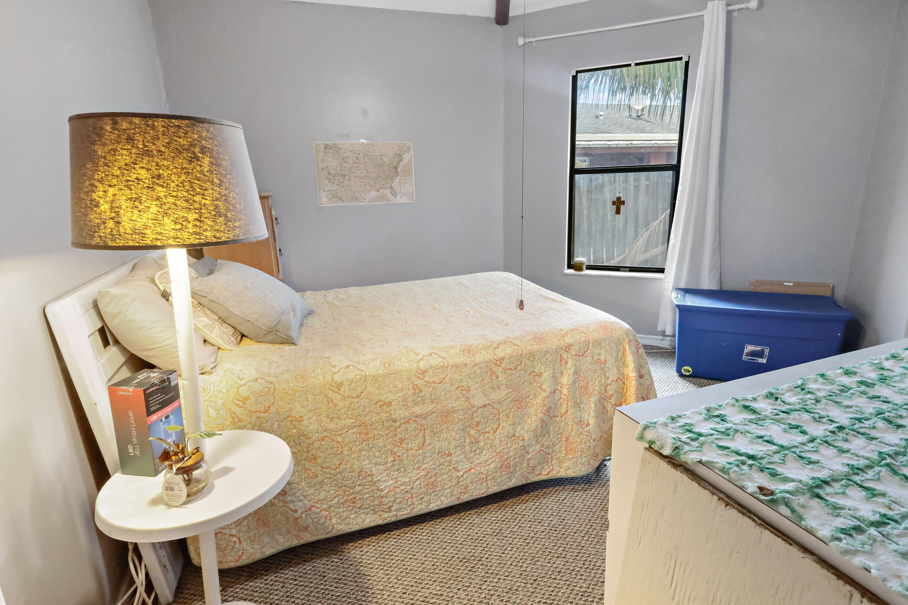 1466 24th Avenue Southwest Vero Beach, FL 32962 - Photo 15 of 29 a bedroom with a bed and a lamp