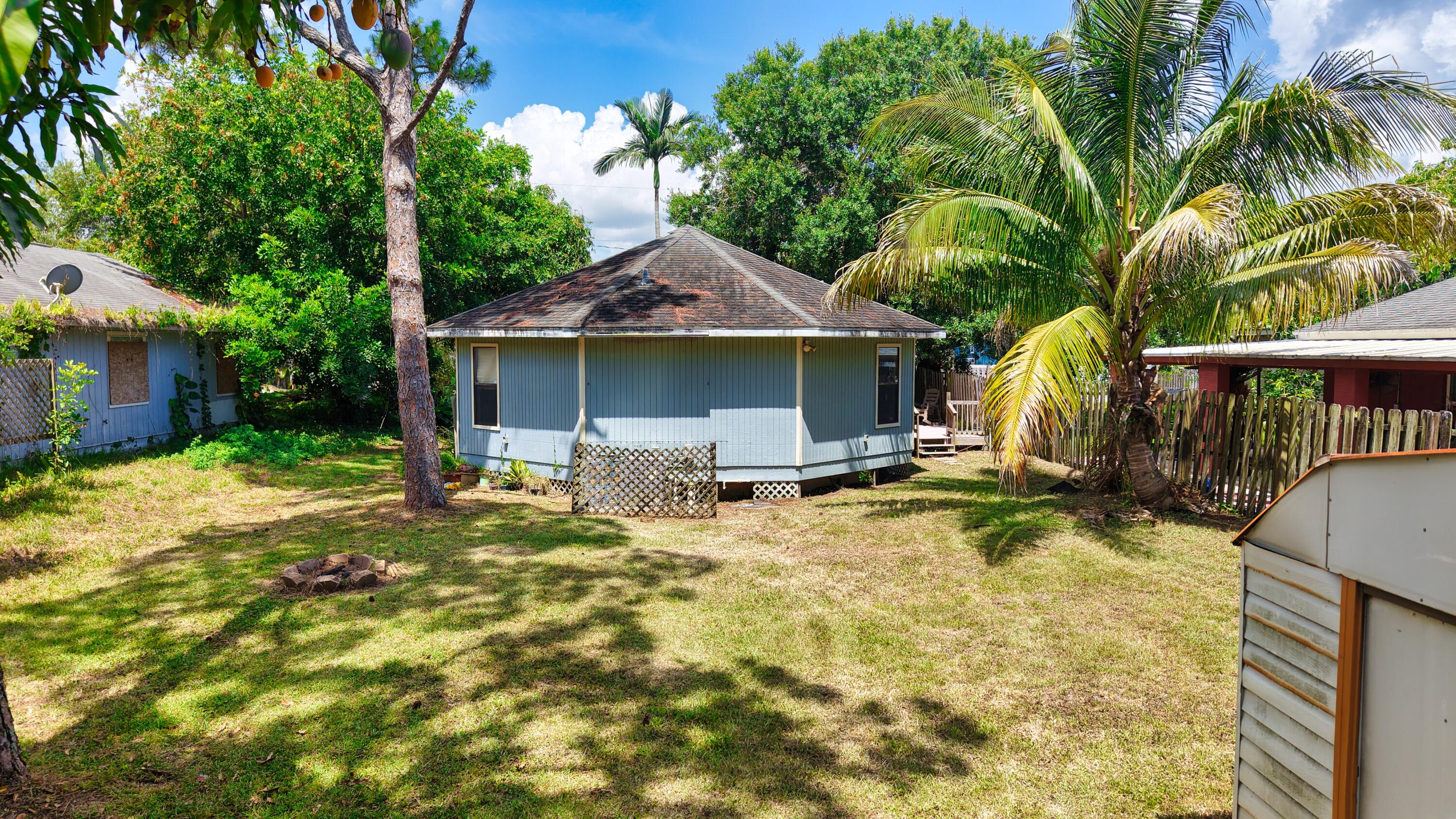 1466 24th Avenue Southwest Vero Beach, FL 32962 - Photo 27 of 29 a swimming pool with outdoor seating yard and barbeque oven