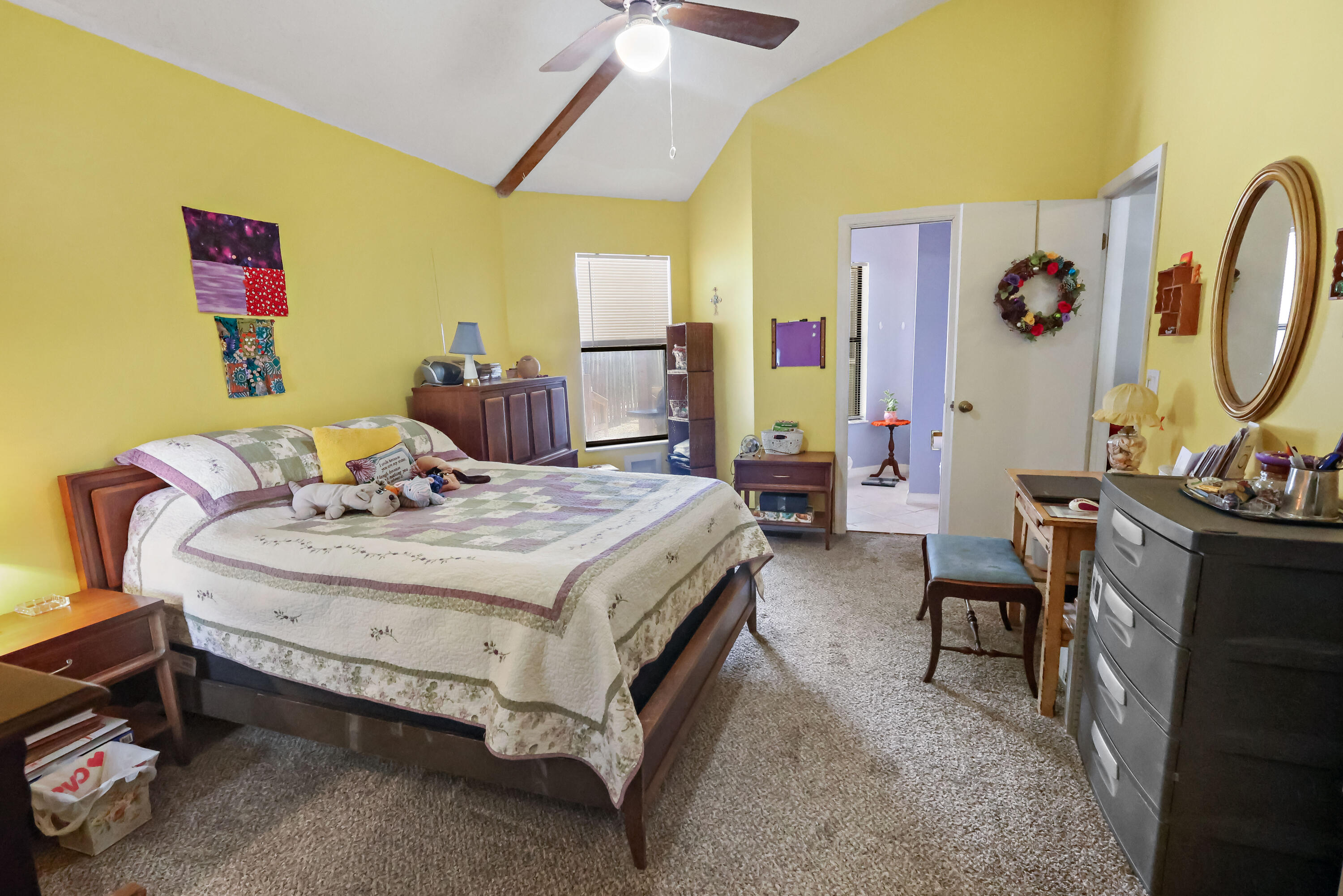 1466 24th Avenue Southwest Vero Beach, FL 32962 - Photo 10 of 29 a bedroom with a bed and a mirror