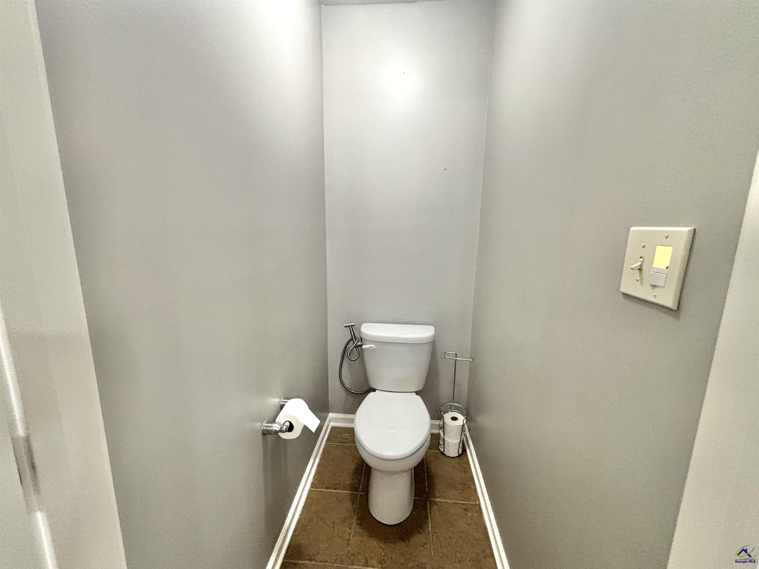 600 Post Oak Way Warner Robins, GA 31088 - Photo 37 of 50 a white toilet sitting in a bathroom