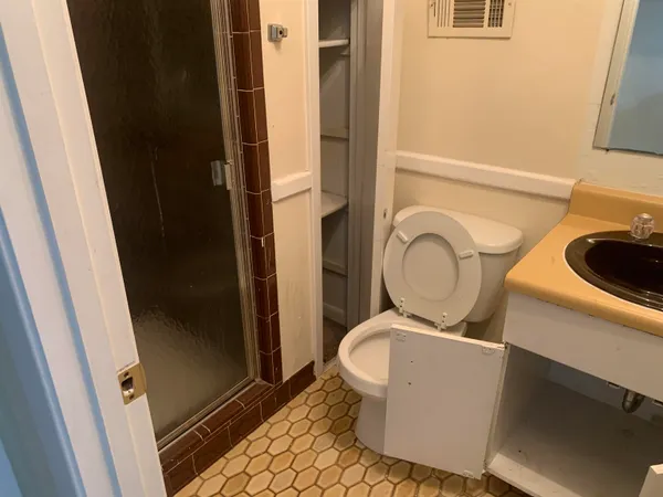 a bathroom with a sink and a toilet