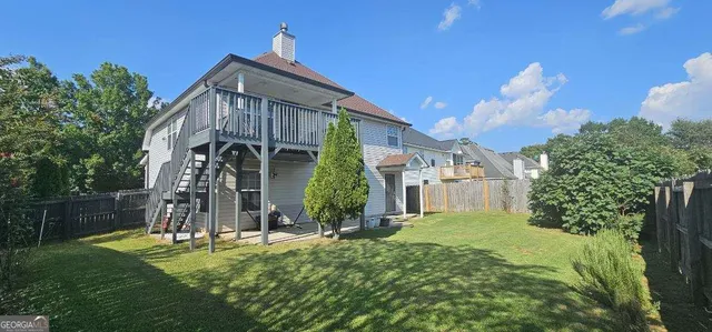 a view of a front of a house with a yard