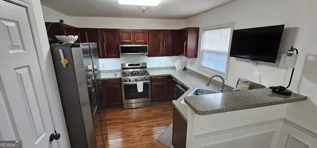 a kitchen with stainless steel appliances and a sink