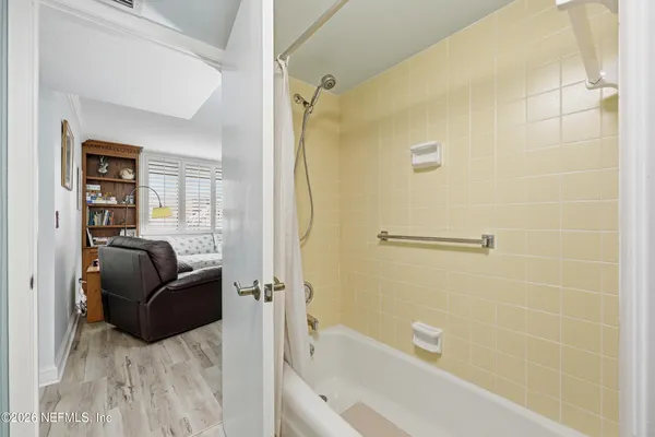 a living room with a couch and a shower