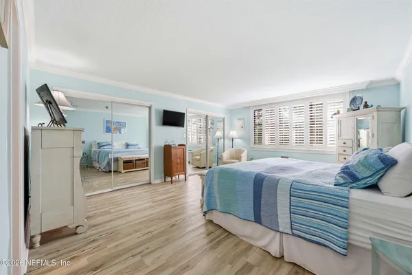 a bedroom with furniture and a fireplace