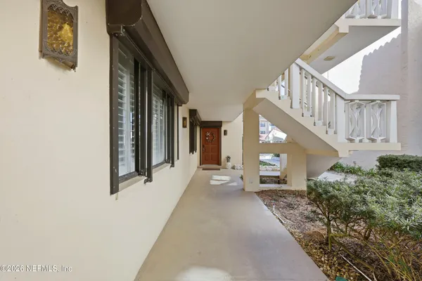 a view of a hallway with staircase