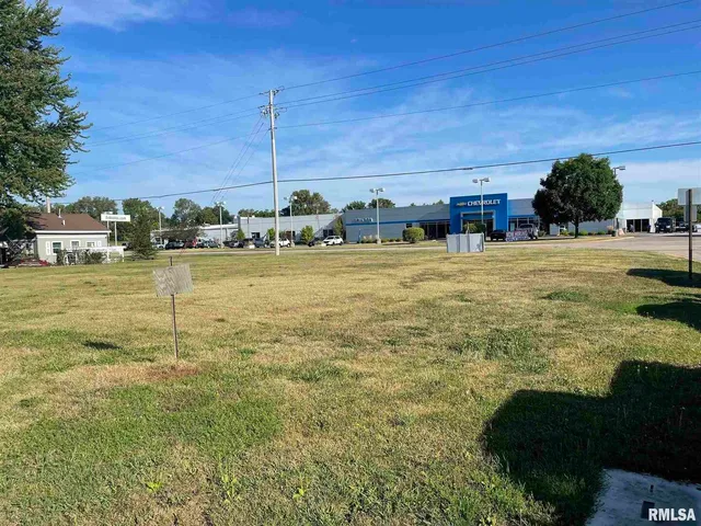 a view of a swimming pool and an outdoor seating