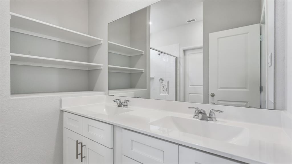 9621 Austin Holw Road Fort Worth, TX 76036 - Photo 10 of 23 a bathroom with a sink and a mirror