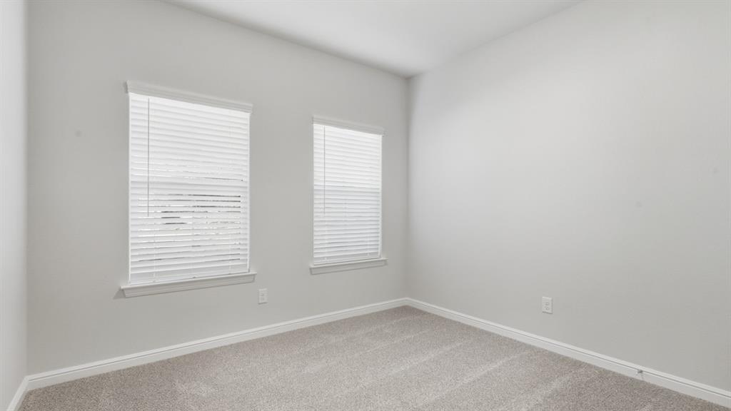9621 Austin Holw Road Fort Worth, TX 76036 - Photo 13 of 23 an empty room with windows