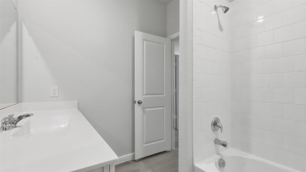 9621 Austin Holw Road Fort Worth, TX 76036 - Photo 15 of 23 a bathroom with a bathtub and a sink