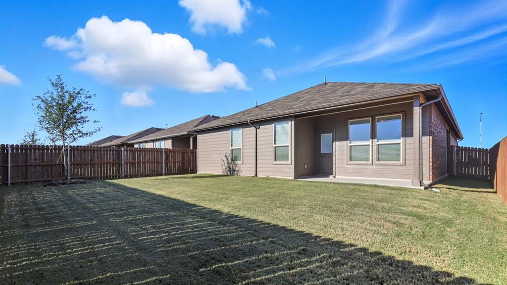 9621 Austin Holw Road Fort Worth, TX 76036 - Photo 20 of 23 a view of a house with a yard