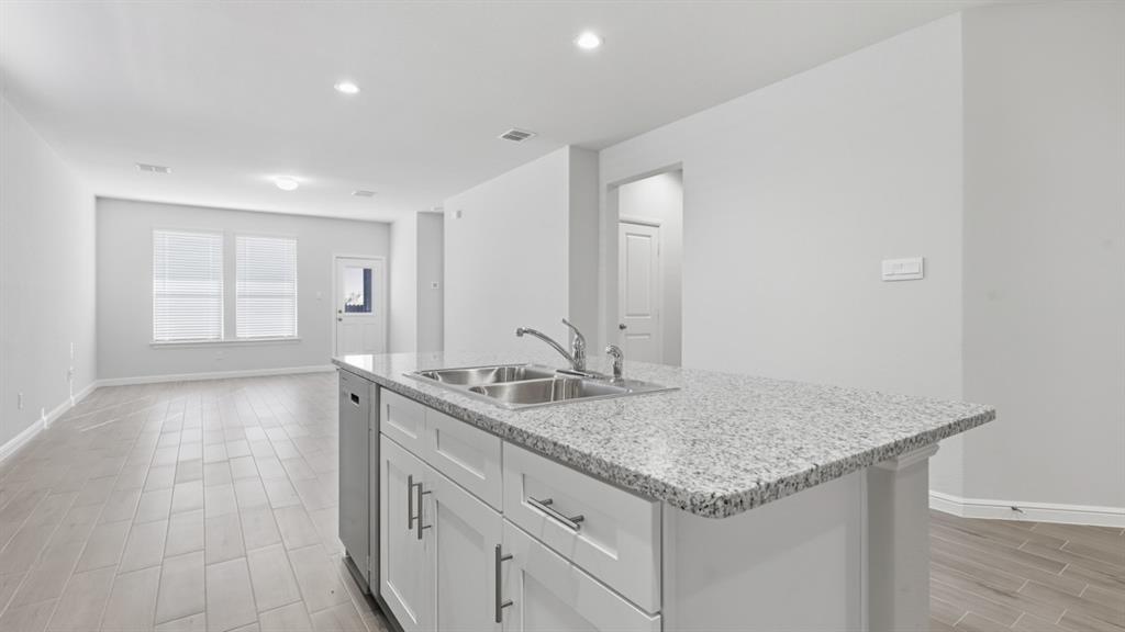 9621 Austin Holw Road Fort Worth, TX 76036 - Photo 3 of 23 a bathroom with a granite countertop sink and a mirror