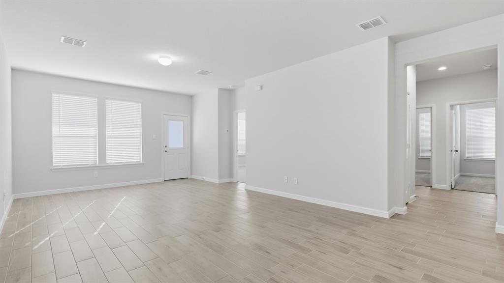 9621 Austin Holw Road Fort Worth, TX 76036 - Photo 5 of 23 wooden floor in an empty room with a window