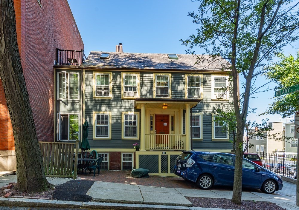 26 Cedar Street Boston, MA 02129 - Photo 2 of 19 a front view of a house with a yard