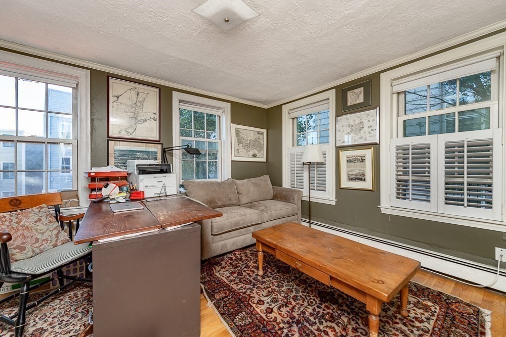 26 Cedar Street Boston, MA 02129 - Photo 3 of 19 a living room with furniture and a large window