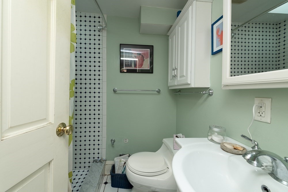 26 Cedar Street Boston, MA 02129 - Photo 8 of 19 a bathroom with a sink a toilet and shower