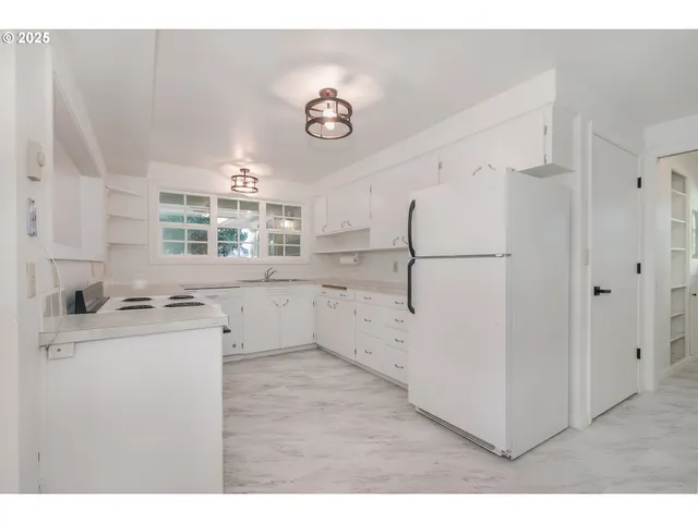 a kitchen with a refrigerator a sink and dishwasher