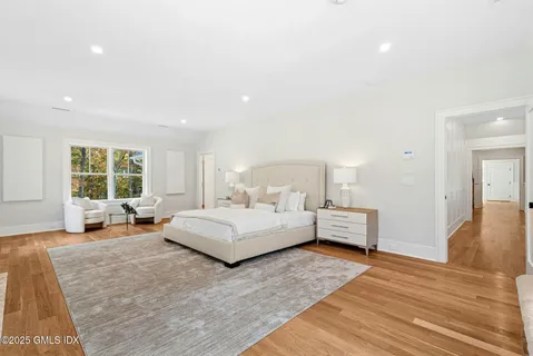 a spacious bedroom with a large bed and a couch
