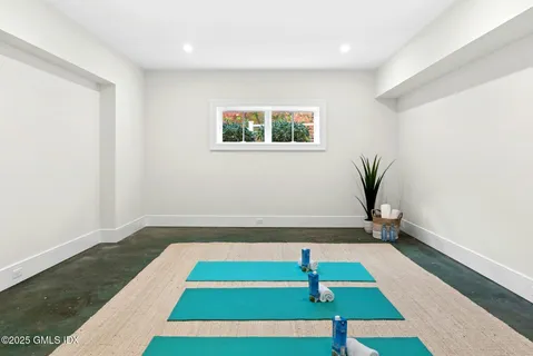 a room with pool and window