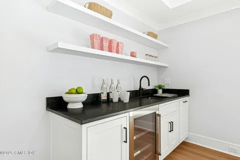 a close view of sink and cabinets