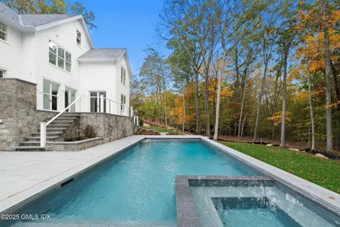 a view of a house with swimming pool