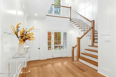 a view of entryway with wooden floor