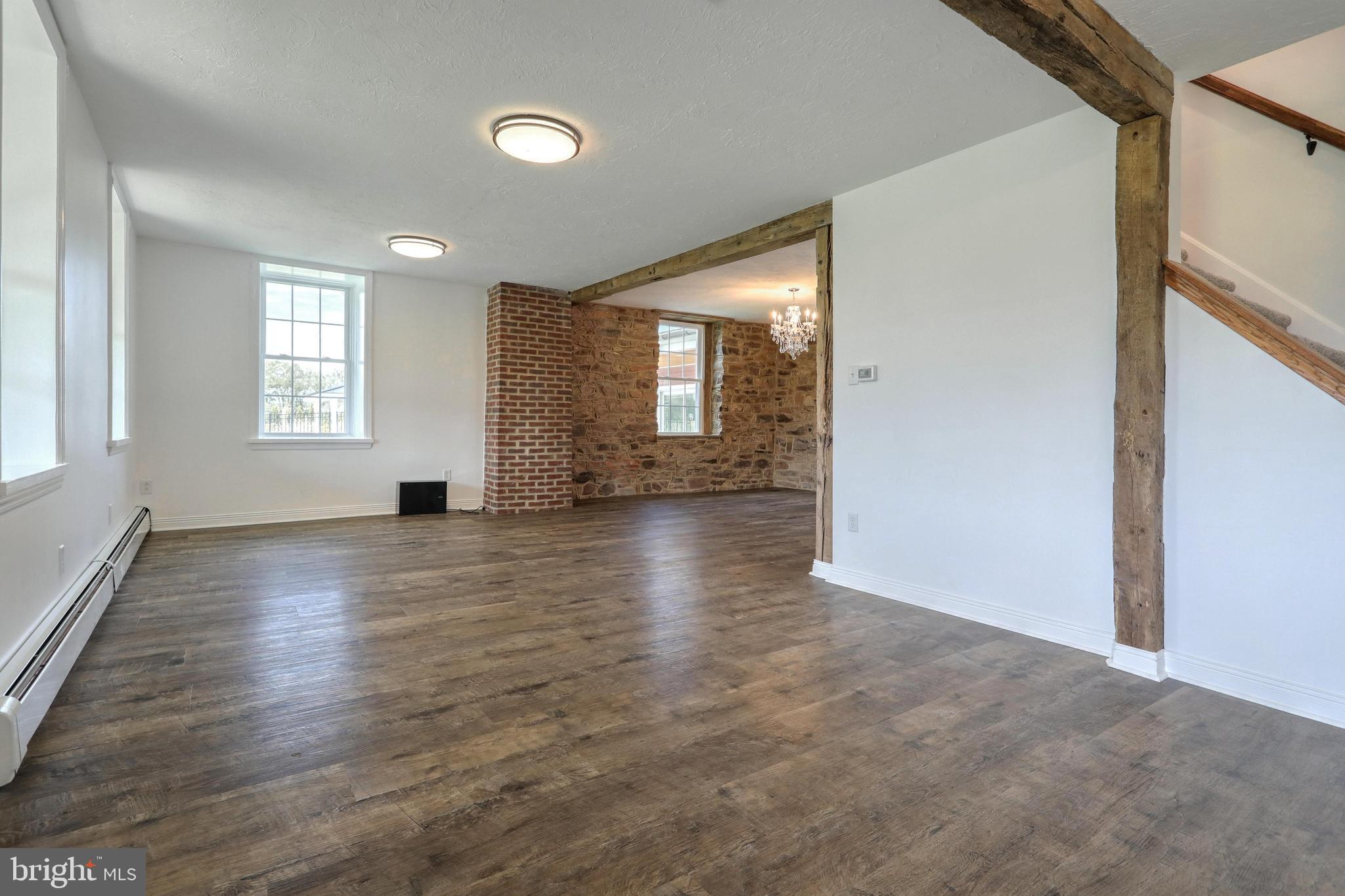270 Cedar Ridge Road New Oxford, PA 17350 - Photo 26 of 129 an empty room with wooden floor and windows
