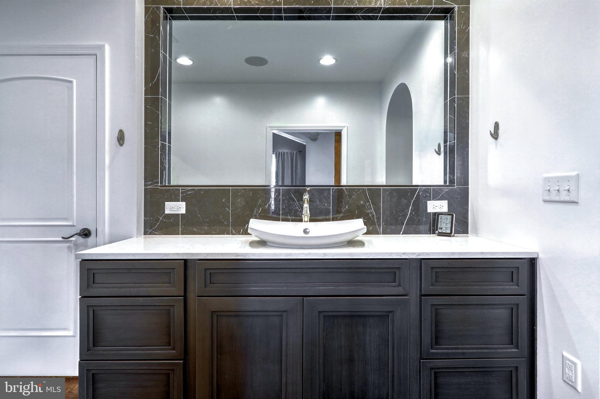 270 Cedar Ridge Road New Oxford, PA 17350 - Photo 53 of 129 a bathroom with a double vanity sink and a mirror