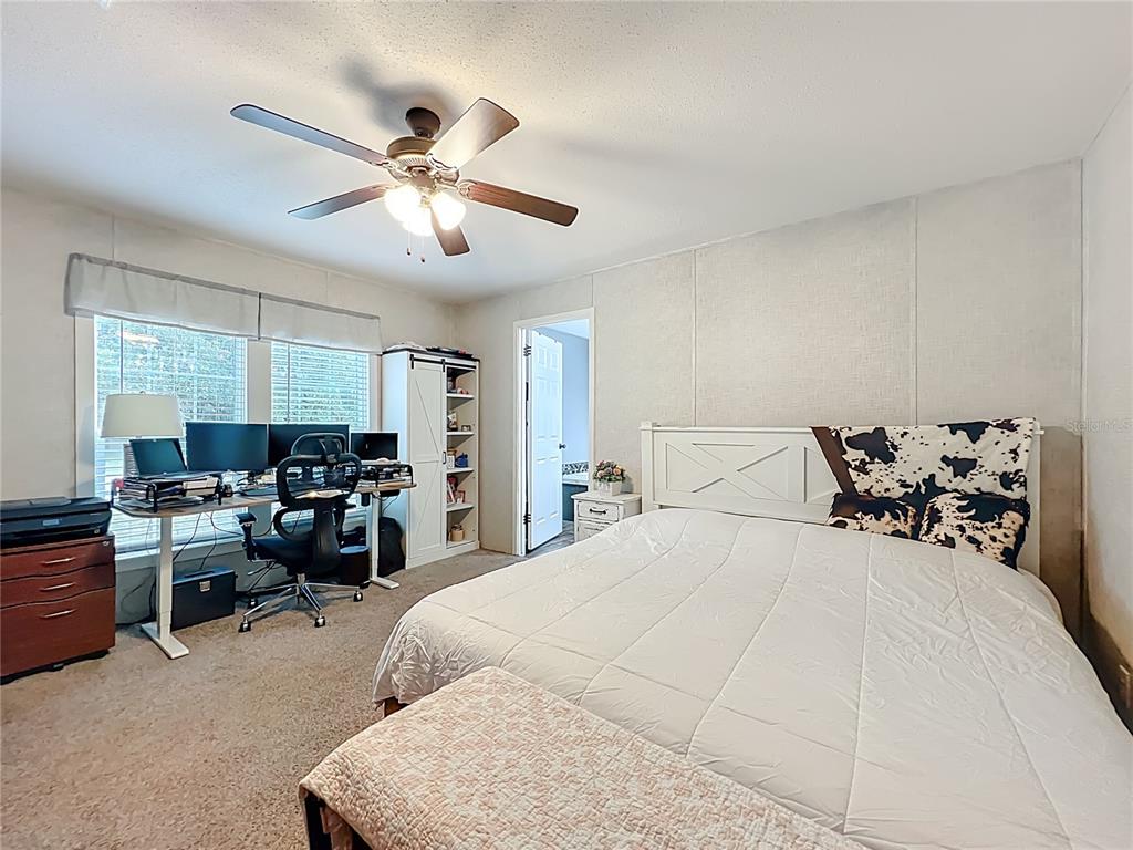 2815 Southwest 89th Place Ocala, FL 34476 - Photo 16 of 36 a bedroom with bed and window