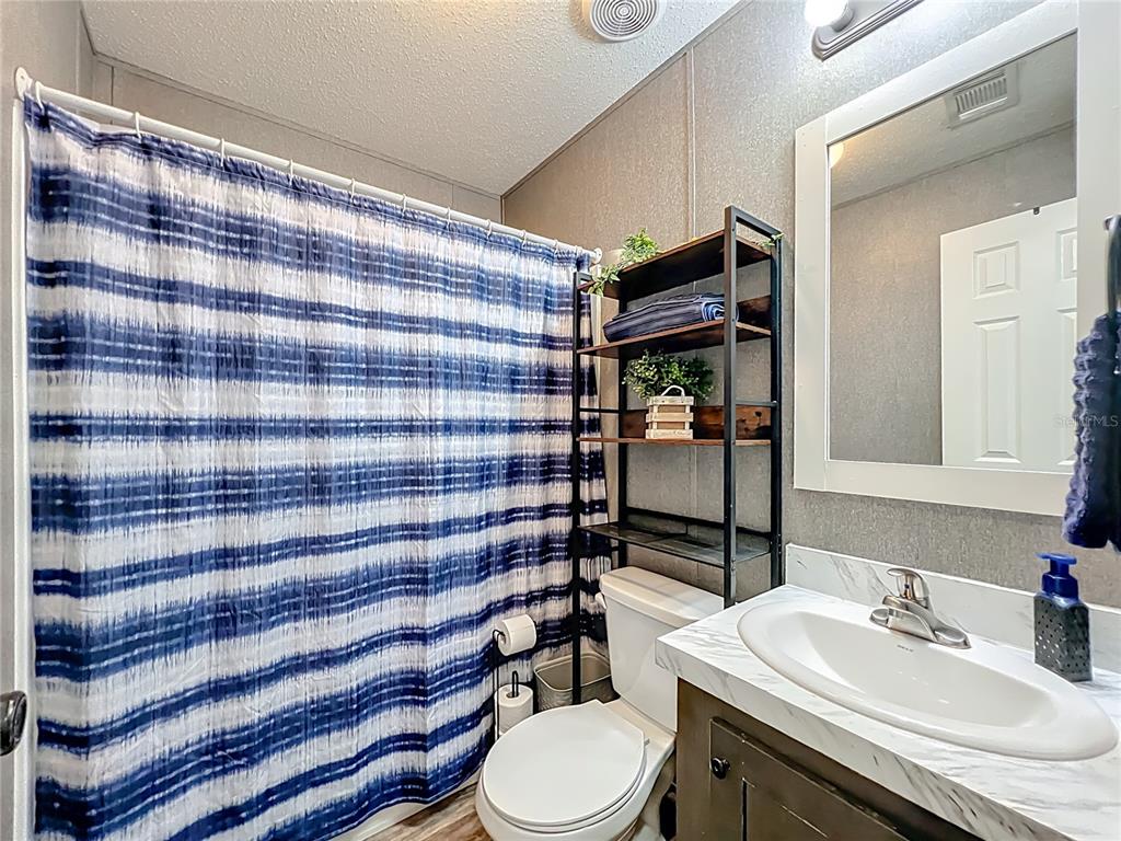 2815 Southwest 89th Place Ocala, FL 34476 - Photo 25 of 36 a bathroom with a sink toilet and shower