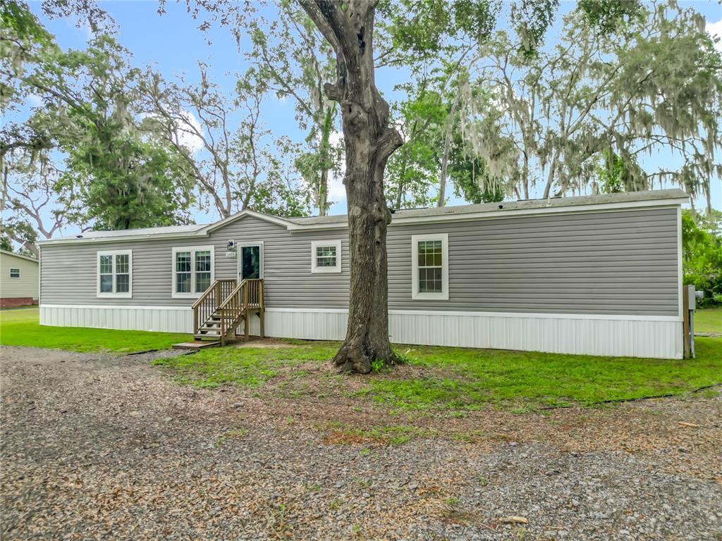 2815 Southwest 89th Place Ocala, FL 34476 - Photo 33 of 36 a house with garden in front of it